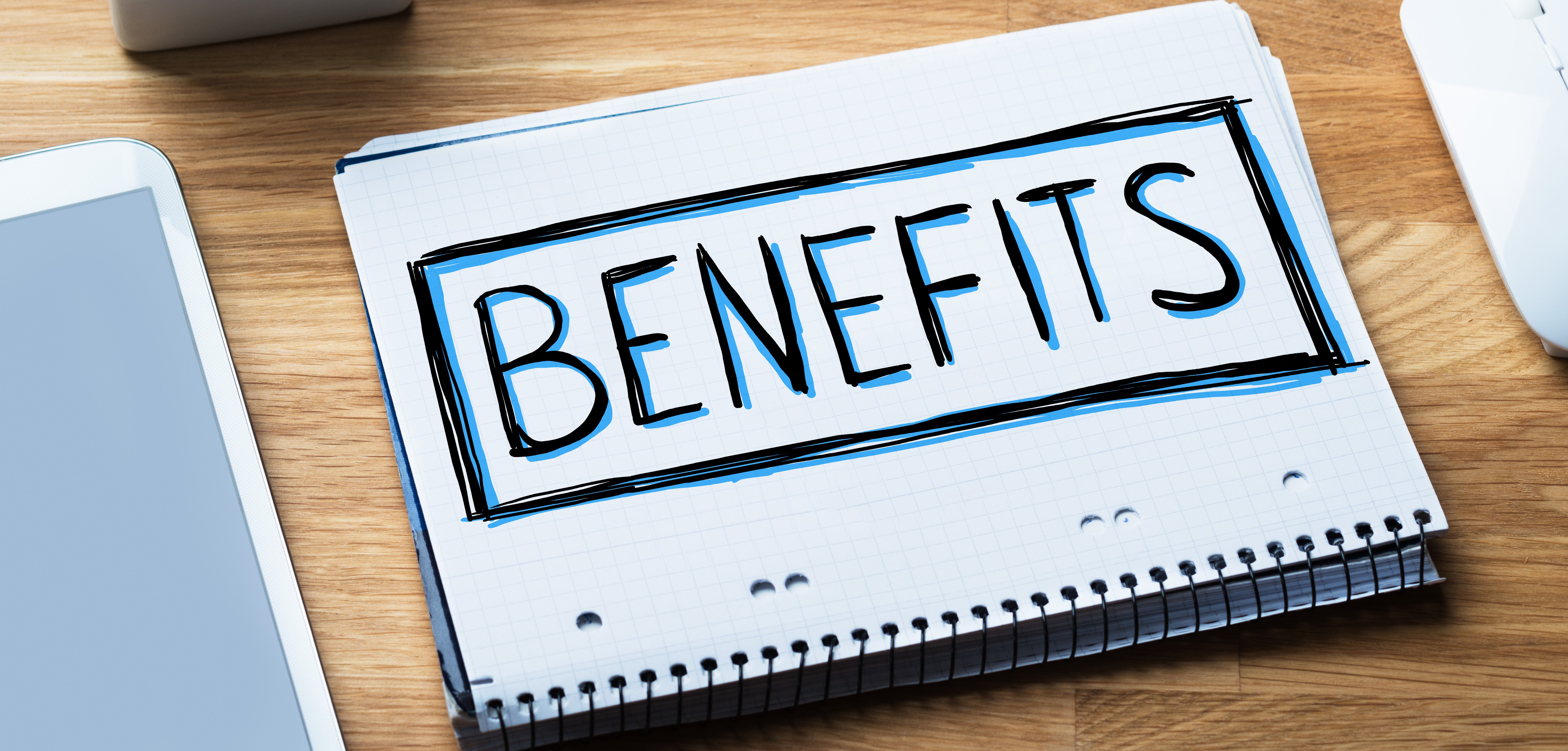 BENEFITS written in a notebook
